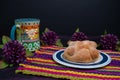 Pan de Muerto, Bread of Dead Mexican Sugar Scone on Woven Tablecloth. Royalty Free Stock Photo