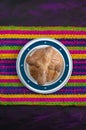 Pan de Muerto, Bread of Dead Mexican Sugar Scone on Woven Tablecloth. Royalty Free Stock Photo