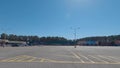 Pan of a empty Covid-19 vaccine staging building set up with orange cones and parking lot