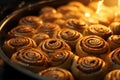 a pan filled with cinnamon buns on a stove