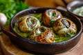 A pan filled with snails is covered in a vibrant green sauce, creating a visually striking image, Dish of exotic Escargot with Royalty Free Stock Photo