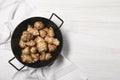 Pan with fresh Jerusalem artichokes on white wooden table, top view. Space for text Royalty Free Stock Photo