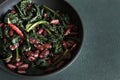 Pan - fried black cabbage, red beans, chili and bread. Royalty Free Stock Photo