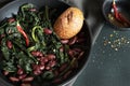 Pan - fried black cabbage, red beans, chili and bread. Royalty Free Stock Photo