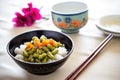 pan-fried edamame with sesame seeds, chopsticks aside Royalty Free Stock Photo