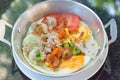 Pan-fried egg with toppings. Royalty Free Stock Photo