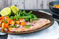 Pan fried gammon with papaya salsa Royalty Free Stock Photo