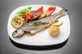 Pan fried grilled roasted cooked whole fish trout sea bass salmon cod