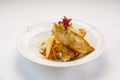 Pan fried halibut with creamy pasta and mushroom served in plate isolated on wooden table side view of hong kong fast food Royalty Free Stock Photo