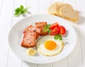 Pan-fried Leberkase with sunny side up fried egg Royalty Free Stock Photo