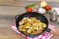 Pan with fried pieces of meat on wooden table Royalty Free Stock Photo