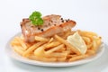Pan fried pork chop with fries Royalty Free Stock Photo