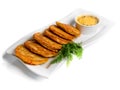 Pan-fried potato pancakes traditional potato fritters on a plate isolated on white background.