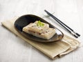 Pan-fried Radish Cake Served in a dish isolated on wooden board side view on grey background Royalty Free Stock Photo