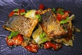 Pan fried sea bass fillet with mediterranean style sauteed fennel, chicory and cherry tomato with lemon sauce Royalty Free Stock Photo