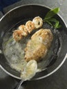 Pan-frying sweetbreads and a shrimp brochette Royalty Free Stock Photo
