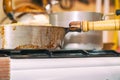 Pan on the gas stove close-up. Kitchen utensils Royalty Free Stock Photo