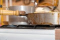 Pan on the gas stove close-up. Kitchen utensils Royalty Free Stock Photo