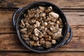 Pan of gold nuggets on wooden table, top view Royalty Free Stock Photo