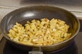 a pan with ingredients for preparing scrambled eggs, cheese, fried potatoes Royalty Free Stock Photo