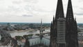 Pan out of the Cologne Cathedral during it\'s renovation construction revealing the landscape of Cologne, Germany.