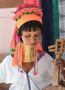 Elderly Kayan woman with a guitar.