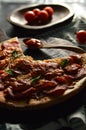 Pan of pizza,sauce and tomatoes on the desk Royalty Free Stock Photo