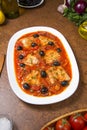 Pan seared fish with tomatoes and olives. Selected focus. Royalty Free Stock Photo