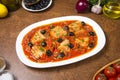 Pan seared fish with tomatoes and olives. Selected focus. Royalty Free Stock Photo