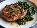 Pan-Seared Pork Chop with Sauteed Spinach and Sage