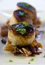 Pan seared scallops over pork belly Royalty Free Stock Photo