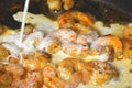 Shrimp and Sauce Cooking in Pan on Stove