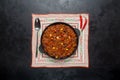 Pan of Texas chili on black background. Royalty Free Stock Photo