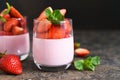 Pana cotta with strawberries and mint on a dark concrete background. Horizontal focus Royalty Free Stock Photo