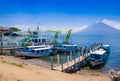 Panajachel, Guatemala -April, 25, 2018: The docks in Panajachel with San Pedro volcano in the background. A few small