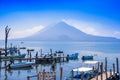 Panajachel, Guatemala -April, 25, 2018: The docks in Panajachel with San Pedro volcano in the background. A few small