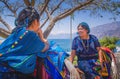 Panajachel, Guatemala -April, 25, 2018: Outdoor view of unidentifed indigenous woman,wearing typical clothes talking