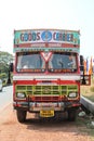 Colorful cargo truck under a summer blue sky with rich decorative paintings, typical for the trucks in India.