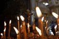 Panakhida, Easter, funeral liturgy in the Orthodox Church. Christians light candles in front of an Orthodox cross with a crucifix Royalty Free Stock Photo
