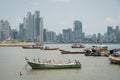 Fishing boats at commercial fish market harbour with skyline bac Royalty Free Stock Photo