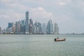 Fishing boats at commercial fish market harbour with skyline bac Royalty Free Stock Photo