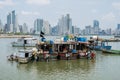 Fishing boats at commercial fish market harbour with skyline bac Royalty Free Stock Photo