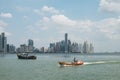 Fishing boats at commercial fish market harbour with skyline bac Royalty Free Stock Photo