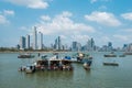 Fishing boats at commercial fish market harbour with skyline bac Royalty Free Stock Photo