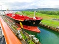 Panama Canal, Panama - December 7, 2019: A cargo ship entering the Miraflores Locks in the Panama Canal Royalty Free Stock Photo