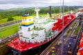 Panama Canal, Panama - December 7, 2019: A cargo ship entering the Miraflores Locks in the Panama Canal Royalty Free Stock Photo