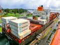 Panama Canal, Panama - December 7, 2019: A cargo ship entering the Miraflores Locks in the Panama Canal Royalty Free Stock Photo