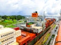 Panama Canal, Panama - December 7, 2019: A cargo ship entering the Miraflores Locks in the Panama Canal Royalty Free Stock Photo