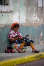 Views of an indigenous woman sewing in Panama City