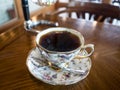 Panama Geisha hand drip coffee in a cup with flower pattern in Gangneung, Gangwon province, South Korea. Royalty Free Stock Photo